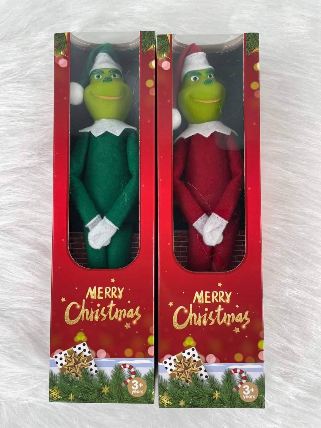 Grinch dolls in Christmas gift boxes