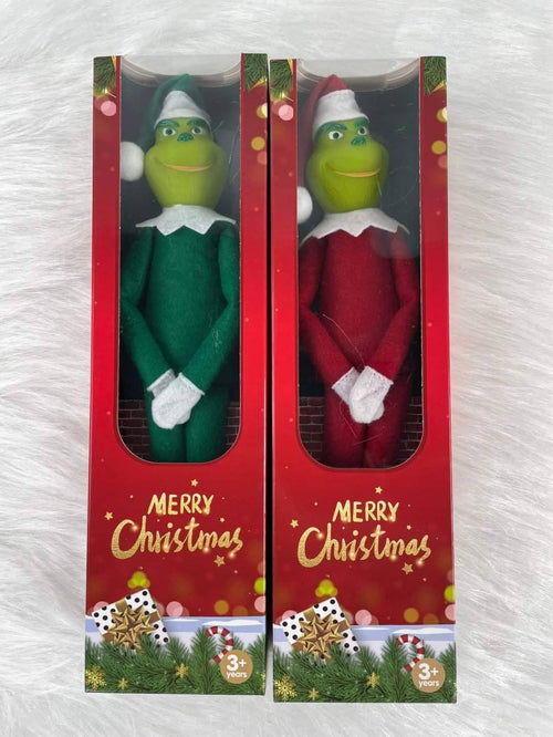 Grinch dolls in Christmas gift boxes